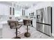 Modern kitchen with stainless steel appliances and breakfast bar at 1103 S Prospect Ave, Clearwater, FL 33756