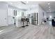 Modern white kitchen with island and stainless steel appliances at 1103 S Prospect Ave, Clearwater, FL 33756