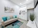 Small kitchenette with white cabinets, a sink, and plenty of counter space at 1103 S Prospect Ave, Clearwater, FL 33756