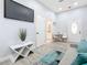 Bright living room with sofa, TV, and access to kitchenette and bathroom at 1103 S Prospect Ave, Clearwater, FL 33756