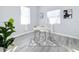 Bright home office with a white desk and gray wood-look floors at 1103 S Prospect Ave, Clearwater, FL 33756