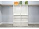 Spacious walk-in closet with built-in shelves and hanging rods at 1103 S Prospect Ave, Clearwater, FL 33756