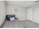 Small bedroom with gray carpet and a single bed at 11127 Hudson Hills Ln, Riverview, FL 33579