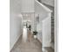 Bright entryway with tile flooring, staircase, and view to living area at 11127 Hudson Hills Ln, Riverview, FL 33579
