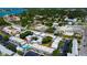 Aerial view of community with pool and surrounding buildings at 1151 Rue Des Chateaux, St Petersburg, FL 33707