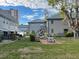 Community backyard with picnic tables and landscaping at 1151 Rue Des Chateaux, St Petersburg, FL 33707