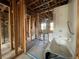 Unfinished bathroom with exposed framing and a bathtub at 1151 Rue Des Chateaux, St Petersburg, FL 33707