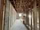 Unfinished bedroom with exposed framing and toilet at 1151 Rue Des Chateaux, St Petersburg, FL 33707