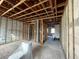 Unfinished bedroom with exposed framing and a toilet at 1151 Rue Des Chateaux, St Petersburg, FL 33707