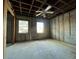 Unfinished bedroom with exposed framing and ceiling fan at 1151 Rue Des Chateaux, St Petersburg, FL 33707