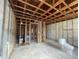 Unfinished bedroom with exposed framing and a toilet at 1151 Rue Des Chateaux, St Petersburg, FL 33707