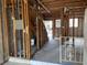 Under construction home interior with exposed framing and unfinished stairs at 1151 Rue Des Chateaux, St Petersburg, FL 33707