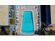 Inviting community pool with plenty of lounge chairs at 1151 Rue Des Chateaux, St Petersburg, FL 33707