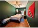 Spacious bedroom with dark wood floors and ceiling fan at 1218 Vinetree Dr, Brandon, FL 33510