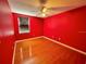 Red walls and hardwood floors at 1218 Vinetree Dr, Brandon, FL 33510