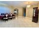 Bright dining room with tile floors and a dark wood table at 1218 Vinetree Dr, Brandon, FL 33510