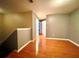 Hardwood floor hallway with doors to bedrooms at 1218 Vinetree Dr, Brandon, FL 33510