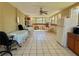 Spacious screened porch with tile floor, ceiling fan, and plenty of room for entertaining at 1218 Vinetree Dr, Brandon, FL 33510
