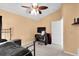 Spacious bedroom with ceiling fan, carpet, and ample natural light at 16216 Heron Hills Dr, Spring Hill, FL 34610