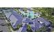 Community clubhouse with tennis courts and large pool area at 16843 Forge Surf St, Land O Lakes, FL 34638