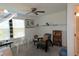 Bright bedroom with ceiling fan, window, and ample closet space at 16843 Forge Surf St, Land O Lakes, FL 34638