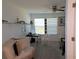 Comfortable bedroom with window and workspace setup at 16843 Forge Surf St, Land O Lakes, FL 34638
