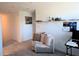 Cozy bedroom with seating area and plenty of natural light at 16843 Forge Surf St, Land O Lakes, FL 34638