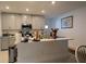 Modern kitchen with gray cabinets and island at 16843 Forge Surf St, Land O Lakes, FL 34638