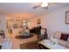 Open living room with adjacent kitchen and dining area at 16843 Forge Surf St, Land O Lakes, FL 34638