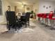 Inviting dining room with an adjacent open kitchen and comfortable seating at 16949 Secret Meadow Dr, Odessa, FL 33556