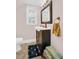 Clean bathroom with dark vanity and a small rug at 2528 3Rd N Ave, St Petersburg, FL 33713