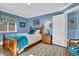 Comfortable bedroom with wooden bed frame and blue accents at 2528 3Rd N Ave, St Petersburg, FL 33713