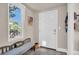 Inviting entryway with a bench and a pet door at 2528 3Rd N Ave, St Petersburg, FL 33713