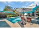 Relaxing pool area with lounge chairs and umbrella at 2528 3Rd N Ave, St Petersburg, FL 33713