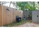 Small backyard with wooden fence and storage shed at 2600 46Th S St, Gulfport, FL 33711