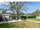 Landscaped backyard with fire pit and pergola at 2600 46Th S St, Gulfport, FL 33711