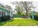 Spacious backyard with fire pit and lush green grass at 2600 46Th S St, Gulfport, FL 33711