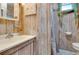 Charming bathroom with wood-paneled walls and shower at 2600 46Th S St, Gulfport, FL 33711