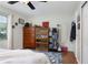 Bedroom with double bed, dresser, and display cabinet at 2600 46Th S St, Gulfport, FL 33711