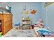 bedroom with twin bed and plenty of bookshelves at 2600 46Th S St, Gulfport, FL 33711