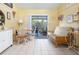 Bright dining area with futon, table and chairs, and access to patio at 2600 46Th S St, Gulfport, FL 33711