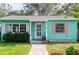 Adorable teal house with white door and pink accents at 2600 46Th S St, Gulfport, FL 33711