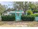 Teal home with white picket fence and arbor entryway at 2600 46Th S St, Gulfport, FL 33711