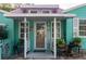 Front porch with teal exterior and plants at 2600 46Th S St, Gulfport, FL 33711