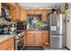 Modern kitchen with granite countertops and wood cabinets at 2600 46Th S St, Gulfport, FL 33711