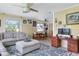 Spacious living room featuring sectional sofa and wood desk at 2600 46Th S St, Gulfport, FL 33711