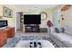 Living room with large TV, comfy sofa, and wood desk at 2600 46Th S St, Gulfport, FL 33711