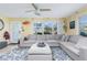 Bright living room with sectional sofa and large windows at 2600 46Th S St, Gulfport, FL 33711