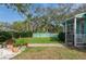 Landscaped side yard with walkway to the front at 2600 46Th S St, Gulfport, FL 33711