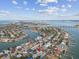 Aerial view of home and neighborhood near water at 2740 E Vina Del Mar Blvd, St Pete Beach, FL 33706
